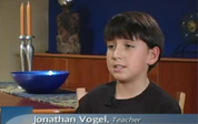 Boy looking at camera is the teacher!